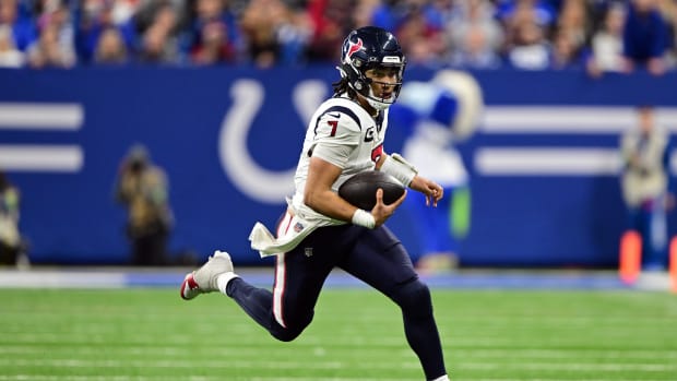 Texans quarterback C.J. Stroud (7) runs the ball against the Indianapolis Colts during the second half at Lucas Oil Stadium.